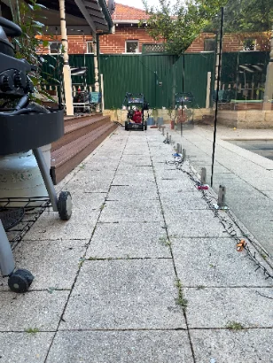 Stained driveway before pressure cleaning